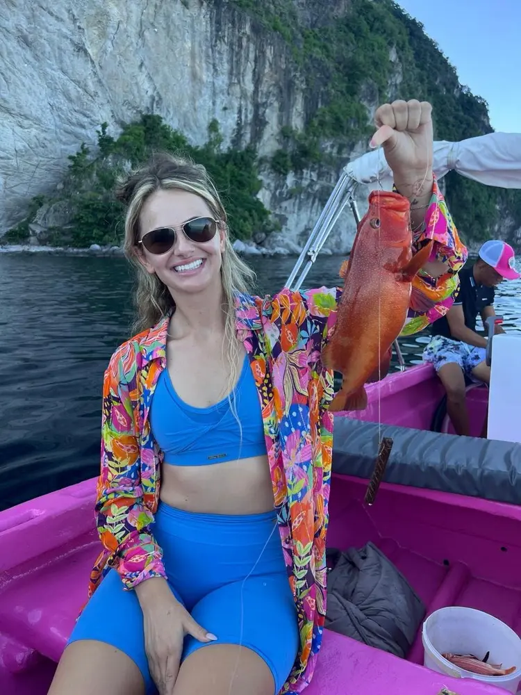 Smiling guest on a colourful St. Lucia boat tour