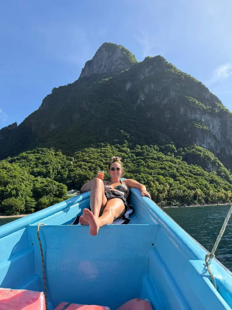 Guests on the blue Let’s Go Land & Sea Tours boat near the Pitons